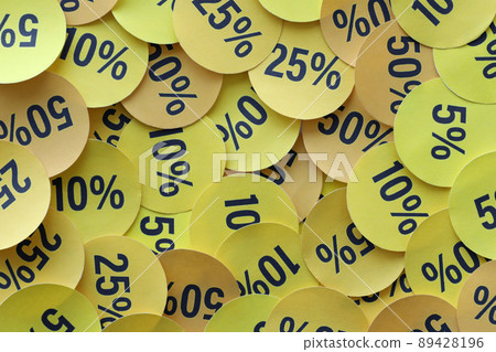 Large amount of stickers with yellow percentage values for black friday or cyber monday sale. Abstract image of discount prices 89428196