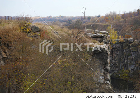 Granite rocks of Bukski Canyon with the Girskyi Tikych River. Picturesque landscape and beautiful place in Ukraine Granite rocks of Bukski Canyon with the Girskyi Tikych River. Picturesque landscape and beautiful place in Ukraine 89428235