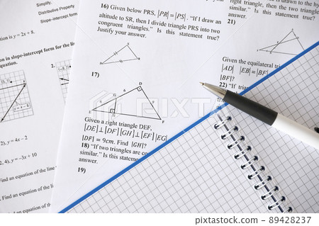 Handwriting of geometrical tasks on examination, practice, quiz or test in geometry class. Solving exponential equations concept. Handwriting of geometrical tasks on examination, practice, quiz or test in geometry class. Solving exponential equations concept. 89428237