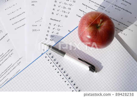Handwriting of mathematics quadratic equation on examination, practice, quiz or test in maths class. Solving exponential equations concept. Handwriting of mathematics quadratic equation on examination, practice, quiz or test in maths class. Solving exponential equations concept. 89428238