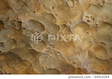 Combination of stone relief like a orange planet surface. Brown stone with abnormal relief shape Combination of stone relief like a orange planet surface. Brown stone with abnormal relief shape 89428264