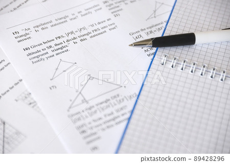 Handwriting of geometrical tasks on examination, practice, quiz or test in geometry class. Solving exponential equations concept. 89428296