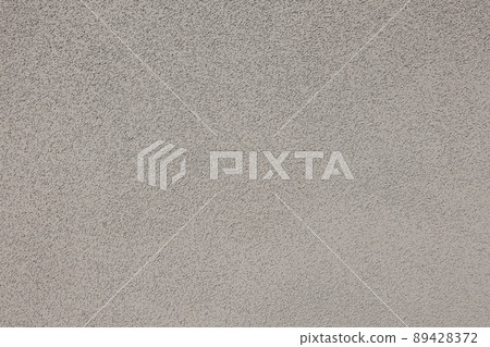 Grungy white concrete wall background. Rough stucco technique in full frame. Detailed texture backdrop 89428372
