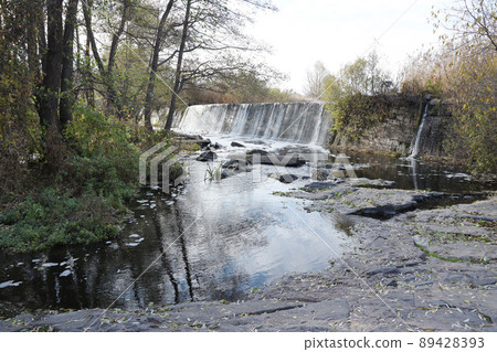 An abandoned dam, an artificial waterfall, the dam of the Butka HPP, is located up the river behind the bridge over the Hirsky Tikich An abandoned dam, an artificial waterfall, the dam of the Butka HPP, is located up the river behind the bridge over the Hirsky Tikich 89428393