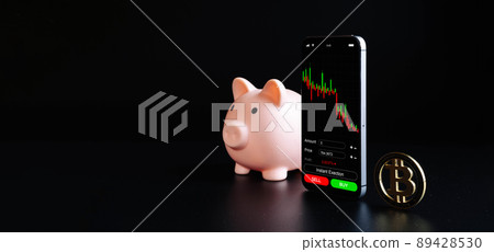 Crypto currency exchange. Pink pig bank, gold crypto currency BTC bitcoin on black background. Bitcoin trading mobile phone app. Save money investment and business finance. 89428530