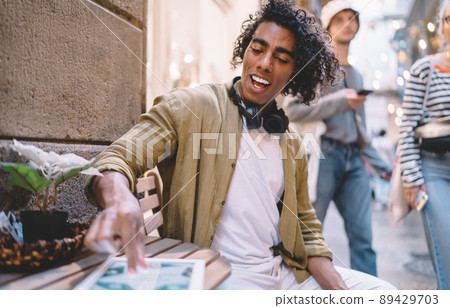 Millennial hipster guy searching web application for browsing wireless in social media 89429703