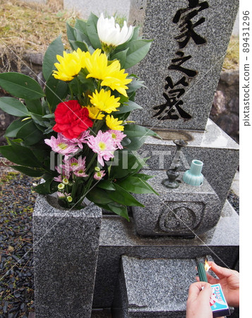 A place to light an incense stick while visiting a grave A place to light an incense stick while visiting a grave 89431296