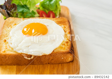 bread toasted with cheese and fried egg bread toasted with cheese and fried egg 89432142