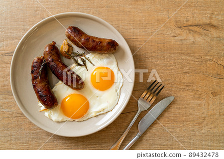 double fried egg with pork sausage 89432478