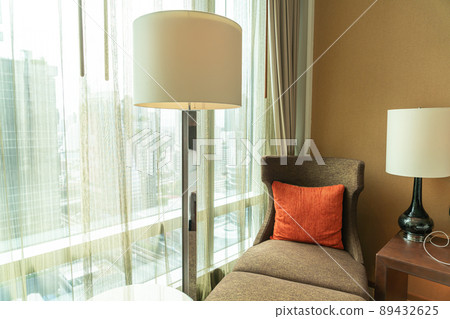 pillow on sofa bed near window 89432625