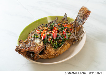 Fried Tilapia Fish with Basil chili garlic sauce 89433699