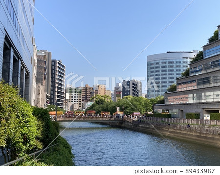 Festival stalls lined up on a bridge over the river Festival stalls lined up on a bridge over the river 89433987