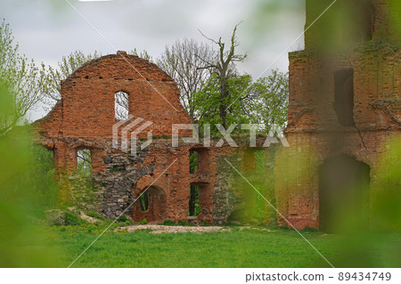 ruins of an ancient castle ukraine. Ruins of expressive red brick gate tower of ancient castle in Korets, Ukraine 89434749