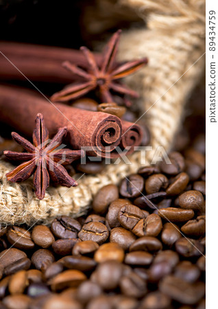 Coffee on the roasted coffee beans background Coffee on the roasted coffee beans background 89434759