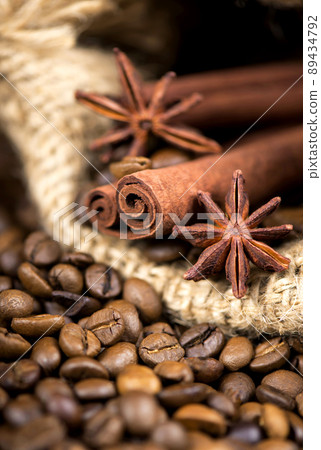 Coffee on the roasted coffee beans background Coffee on the roasted coffee beans background 89434792