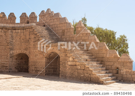 Facade of ancient stone castle and fortress Facade of ancient stone castle and fortress 89438498