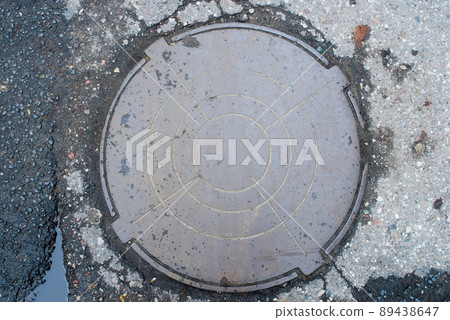 Old manhole in Kaliningrad. Russia Old manhole in Kaliningrad. Russia 89438647