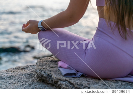 Young woman practicing yoga outdoors. Harmony and meditation concept. Healthy lifestyle Young woman practicing yoga outdoors. Harmony and meditation concept. Healthy lifestyle 89439654