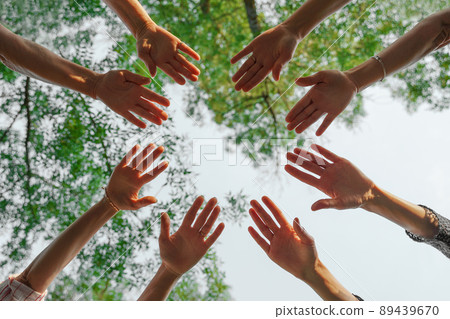 Team stacks hands in a workshop for teambuilding and teambuilding 89439670
