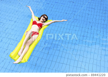lady in sexy red bikini swims luxury hotel pool lady in sexy red bikini swims luxury hotel pool 89441220