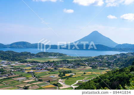 A landscape with Lake Ikeda and Mt. Kaimondake over the countryside 89441834