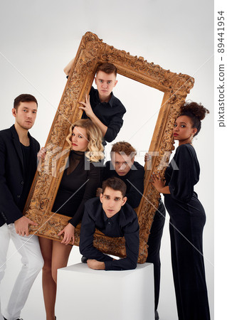studio portrait of Beautiful young diverse group of friends isolated on white background in the frame for a picture, goofy face, good mood studio portrait of Beautiful young diverse group of friends isolated on white background in the frame for a picture, goofy face, good mood 89441954