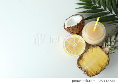 Pina colada cocktail and ingredients on white background Pina colada cocktail and ingredients on white background 89442288
