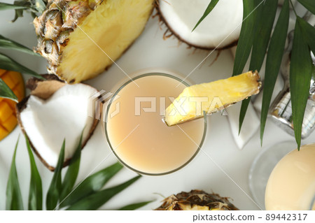Pina colada cocktail and ingredients on white background 89442317