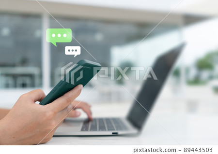 People hand using smartphone typing, chatting or text messages in chat icons pop up. Social media maketing technology concept. People hand using smartphone typing, chatting or text messages in chat icons pop up. Social media maketing technology concept. 89443503
