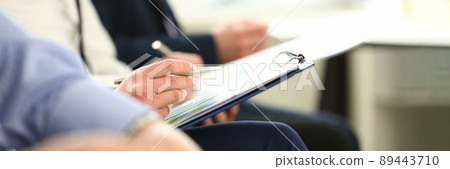Focus on male hands holding paper folder with important Focus on male hands holding paper folder with important 89443710
