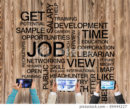 Top view of businesspeople sitting at table and using gadgets Top view of businesspeople sitting at table and using gadgets 89444227