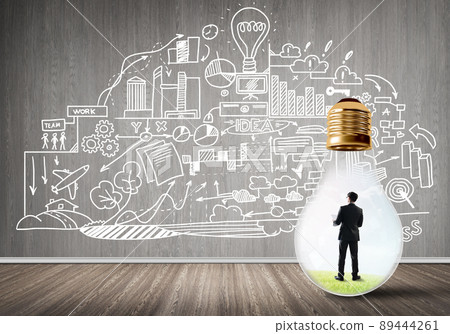 Businessman trapped in bulb 89444261