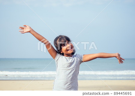 cute girl 7 or 8 years old Asian American mixed enjoying holidays.travel medical insurance concept cute girl 7 or 8 years old Asian American mixed enjoying holidays.travel medical insurance concept 89445691