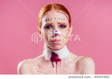 Patient in bandages. Nurses and young woman in studio pink background 89445900