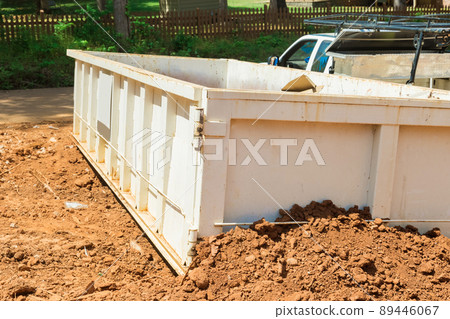 Construction trash dumpsters in an metal container, home house renovation. 89446067
