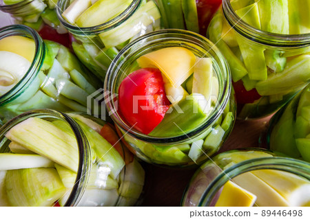 Process of home preserving of zucchini in jars. Canning vegetables for the winter. Closeup, selective focus Process of home preserving of zucchini in jars. Canning vegetables for the winter. Closeup, selective focus 89446498