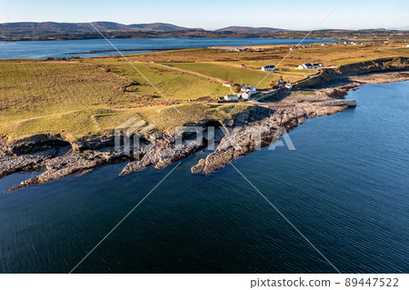 Aerial view of the Ballysaggart pier , the 15th century Franciscan Third Order remains and burial ground at St Johns Point in County Donegal - Ireland. 89447522