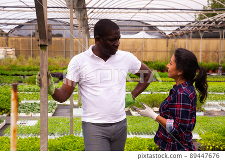 Conversation between two workers during break between work Conversation between two workers during break between work 89447676