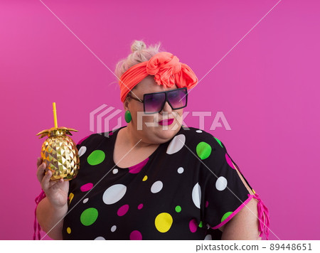 Overweight plus size female, fat women, Fat girl, Chubby, holding golden fruit ananas isolated on pink background - lifestyle Woman diet weight loss overweight problem concept. Overweight plus size female, fat women, Fat girl, Chubby, holding golden fruit ananas isolated on pink background - lifestyle Woman diet weight loss overweight problem concept. 89448651