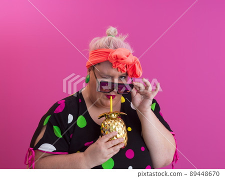 Overweight plus size female, fat women, Fat girl, Chubby, holding golden fruit ananas isolated on pink background - lifestyle Woman diet weight loss overweight problem concept. 89448670
