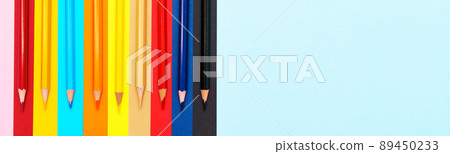 A set of colored pencils on a colorful background. Group of colored wooden 89450233