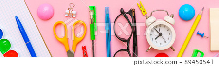 School notebook and various office supplies. Back to school concept. Bright 89450541