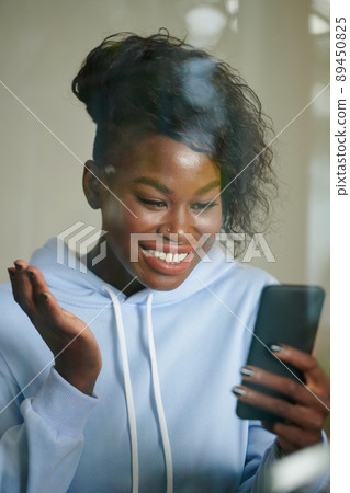 Excited Woman Video Calling Friend 89450825