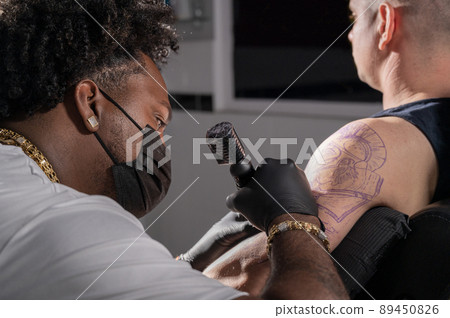 Body art at the tattoo studio 89450826