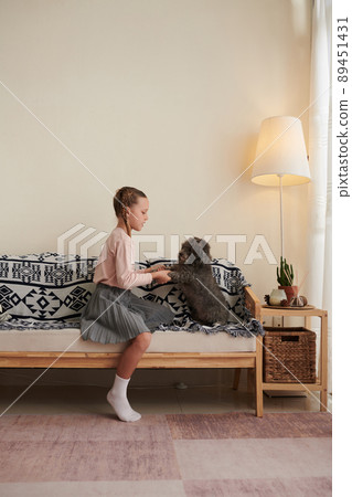 Girl Playing with Dog 89451431