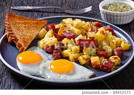 Corned Beef Hash Browns with fried eggs, top view Corned Beef Hash Browns with fried eggs, top view 89452571