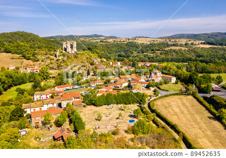 Aerial view of Domeyrat village with its castle in Auvergne, France Aerial view of Domeyrat village with its castle in Auvergne, France 89452635