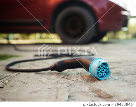 Closeup view at Electric car charging plug 89453946