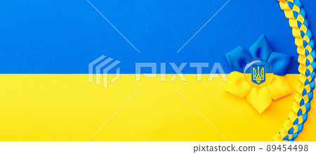 Ukraine flag symbol background. Ukrainian flower trident symbol isolated on yellow blue flag banner. Support Ukraine concept. Ukraine flag symbol background. Ukrainian flower trident symbol isolated on yellow blue flag banner. Support Ukraine concept. 89454498
