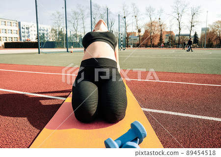 Pregnancy exercise. Pregnant woman training yoga sport exercise. Prenatal healthy fitness active fit gym outside. Pregnancy running. 89454518